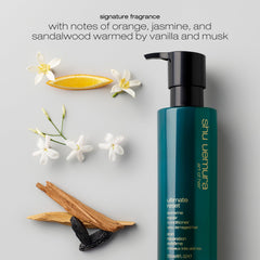 shu uemura bottle in hand showing 8 fl oz scale and travel-friendly benefit