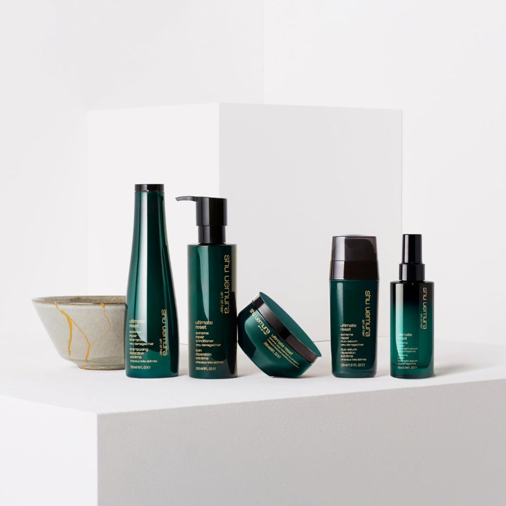 shu uemura lifestyle shelf in bathroom suggesting salon-quality home treatment benefits
