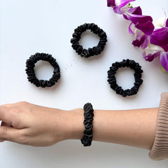 Silvr Bear satin texture close-up showing smooth fabric and reduced hair friction benefit