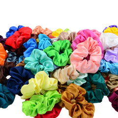 Simnice scrunchie held in hand illustrating large size and stretch for thick hair