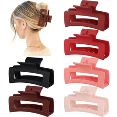 Sisiaipu array of six assorted red and black clips arranged flat