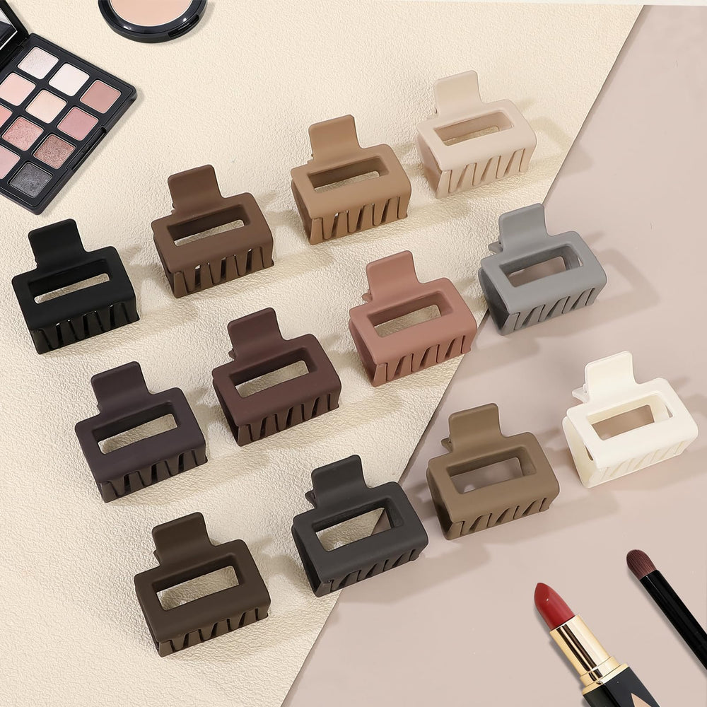 Sisiaipu clips in hand showing 2-inch scale and travel-friendly size