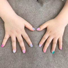SIUSIO kids wearing glitter gradient nails at a birthday party showing playful style
