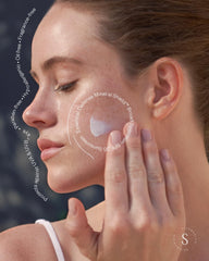 Woman applying SkinMedica sunscreen outdoors indicating daily UV protection benefit