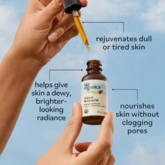Sky Organics travel bottle beside common items to show compact size