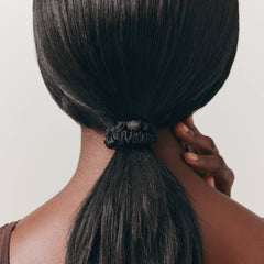 SLIP scrunchie securing a neat bun, reduces tugging and frizz