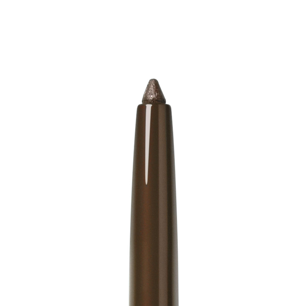 Smashbox pencil next to coin showing compact travel-friendly size