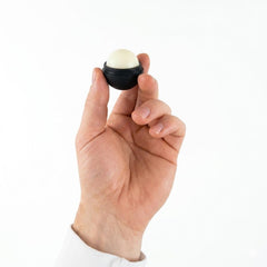 SmileSet spheres resting on a handbag illustrating travel-ready portability and on-the-go lip protection benefit