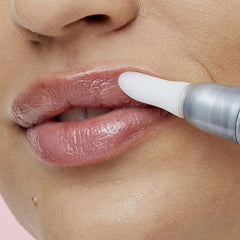 Soap & Glory on model smiling to show fuller-looking lips and natural shine benefit
