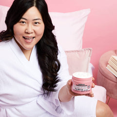 Hand scooping Soap & Glory butter highlighting fast absorbency benefit
