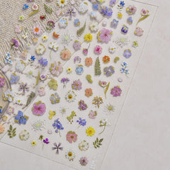 SOFTSOUL lifestyle hands in garden showing floral nail stickers and wearable style