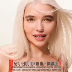 Sol de Janeiro shampoo in shower being applied for repair benefits