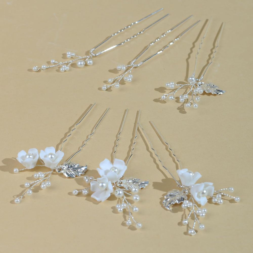 SOLENY pins artfully arranged on white fabric showing coordinated styling options advantage