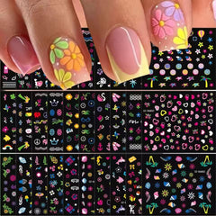 SPLOCUDU finished manicure on hands showcasing colorful designs