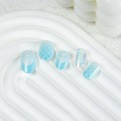 SPNBCQ nails on fingers for scale showing short almond fit and realistic look