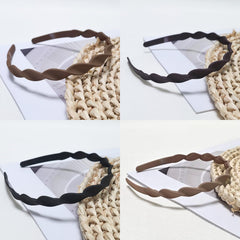 Springtime headband worn by woman sweeping hair back for practical everyday control