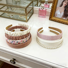 STANETCO assortment of thin and wide styles displayed flat