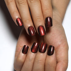 Stbisen close-up of cat eye stripe on wine red nail, striking color shift
