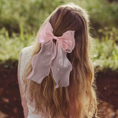 STSTR worn in ponytail demonstrating polished look and comfortable fit