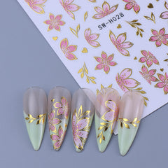 STZPRONAIL lifestyle image of summer manicure using floral decals for festive look