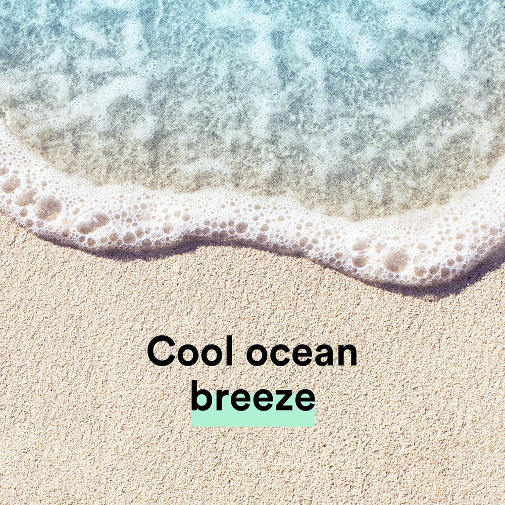 Pouring Suave Ocean Breeze in shower illustrating easy rinse and freshness