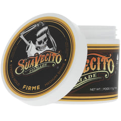 Hand holding a 4 oz Suavecito tin for scale and portable grooming benefit