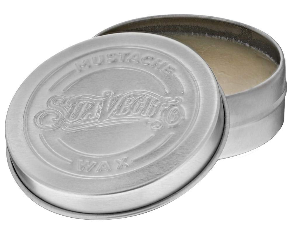 Suavecito scent notes card beside tin showing whiskey and cedarwood aroma benefit