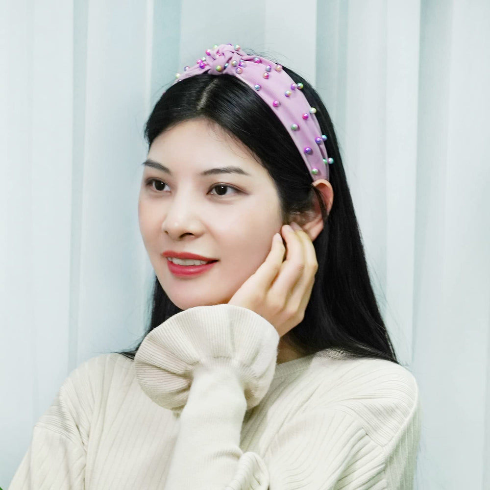 Sucrain headband held in hand for size comparison showing one-size adaptability benefit