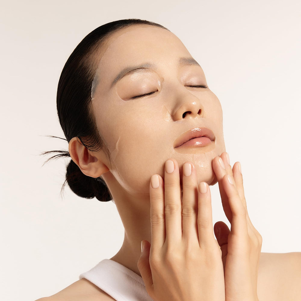 Sulwhasoo sheet mask worn by model illustrating quick at-home hydration