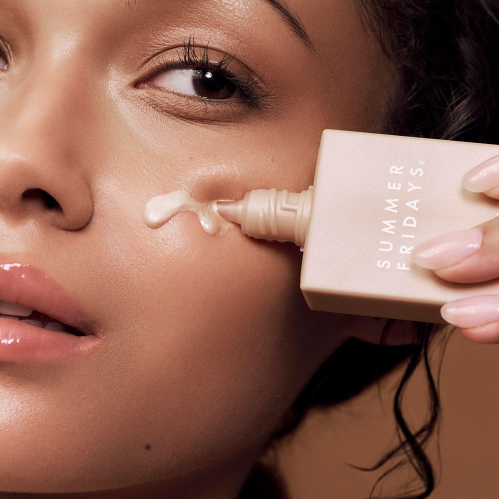 Summer Fridays drops blended into moisturizer for a luminous base