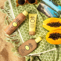 Sun Bum applying face lotion to cheek demonstrating even coverage and lightweight feel