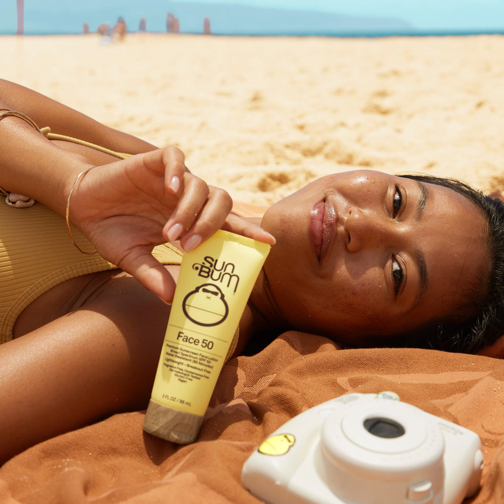 Sun Bum product label close-up showing ingredient list and reef-friendly benefit