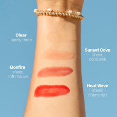Sun Bum lip balm in hand showing 0.5 oz scale and travel-friendly size