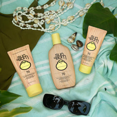 Sun Bum travel bottle in hand showing small size and easy portability benefit