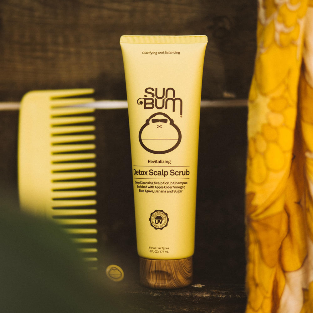 Sun Bum 6 oz tube in hand showing compact travel-friendly size