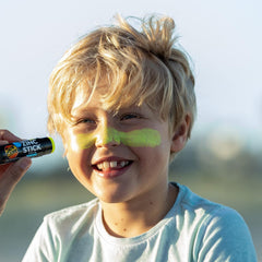 Sun Zapper being applied to nose demonstrating clear coverage benefits