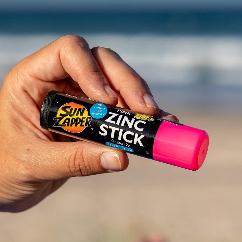 Sun Zapper stick in hand showing travel size and easy portability benefit