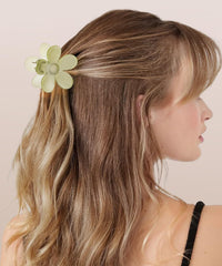 Sunolga clip holding thick curly hair in an updo for all-day hold