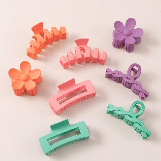 Sunolga front packaging showing eight colorful flower claw clips and variety