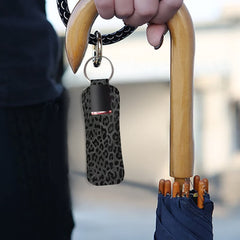 Suobstales holder clipped to bag ring showing hands-free portability and visibility