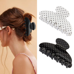 SuPoo clip front view showing polka dot pattern and secure hold