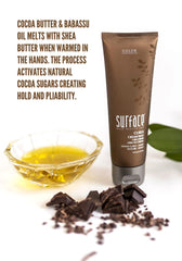 SURFACE pouring cocoa and shea butter to highlight nourishing natural ingredients