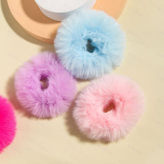 SUSULU scrunchie worn on wrist as cuff highlighting fashion accent and convenience benefit