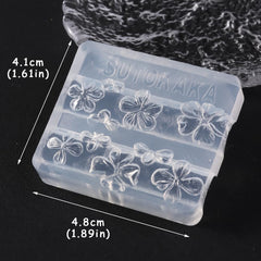 SUTOKAKA floral resin pieces attached to a phone case craft, showing multi-use decoration benefit