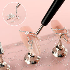 SUTOKAKA beads being placed on a nail showcasing clean application and professional look
