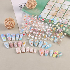 SUTOKAKA sticker sheet held next to a fingertip to show true size and scale