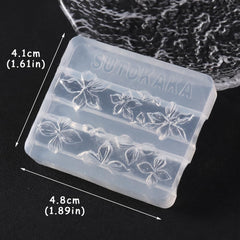 Hand holding SUTOKAKA mold for scale, showing size and portability for salon or home use