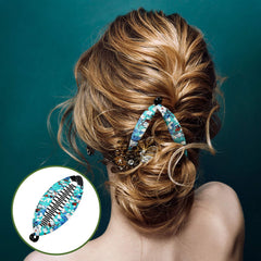 Syhood clip holding a half-up boho hairstyle adding decorative flair and hold