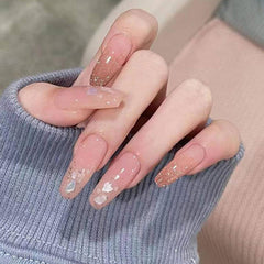Symphonyw abalone lifestyle manicure shot showing finished nails with ocean-inspired shine