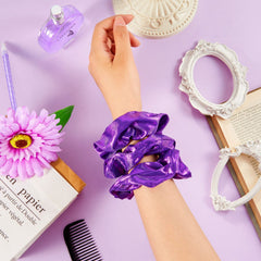 Taiyin scrunchie next to hand for scale demonstrating compact, travel-ready benefit